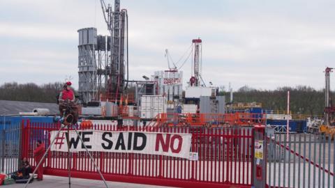 Protestors outside a drilling company