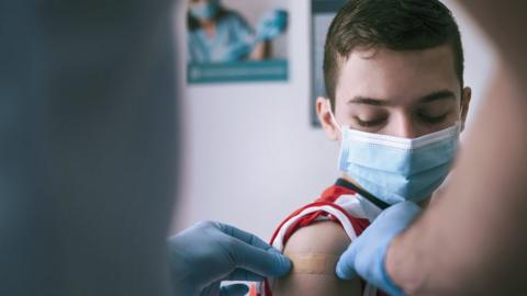 Boy has plaster applied to arm