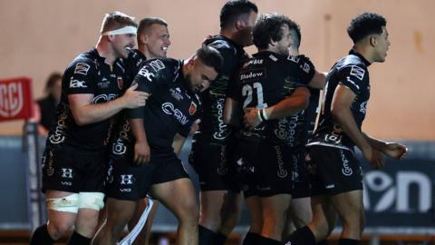 Dragons celebrate win over Scarlets