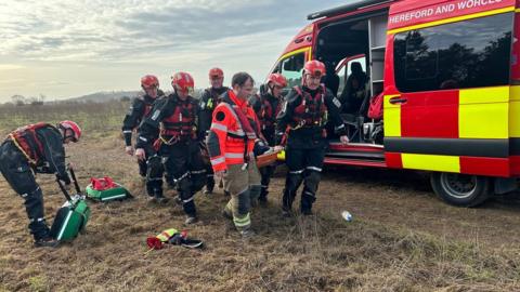Rescue service carrying a stretcher