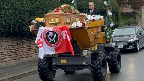 The coffin on its way to the funeral