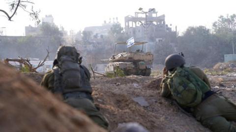 Israel Defense Forces (IDF) handout showing Israeli soldiers and a tank during a military operation inside the Gaza Strip (9 November 2023)