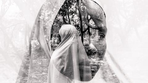 Black and whit portrait of a Nigerian woman wearing a veil