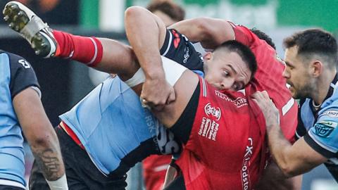 Ellis Jenkins of Cardiff was sent off for this tackle on Scarlets' Dan Davis