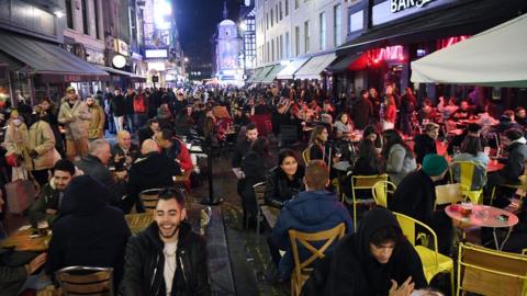 People enjoy their last night out in Soho before a four-week national lockdown