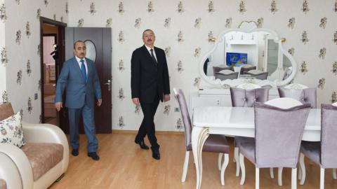 President Ilham Aliyev inspects one of the apartments