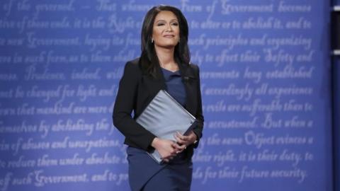 Debate moderator Elaine Quijano arrives on the debate stage at the start of the debate between Democratic U.S. vice presidential nominee Senator Tim Kaine and Republican U.S. vice presidential nominee Governor Mike Pence at Longwood University in Farmville, Virginia, U.S., October 4, 2016.