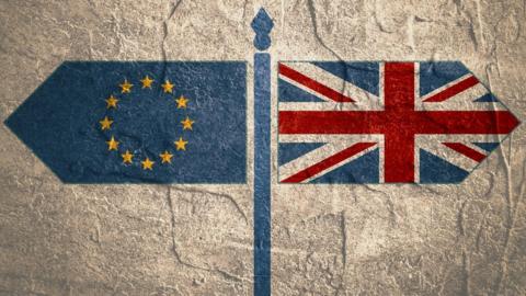 EU and UK flags pointing in opposite directions