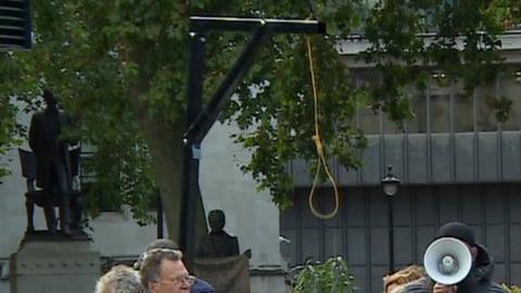 Protesters with gallows