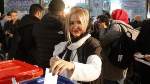 Woman casts vote in mosque in northern Tehran