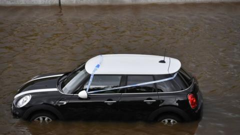 A car stranded in flood water