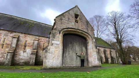 Council leader Ros Wyke outside the Bishop's Barn in Wells