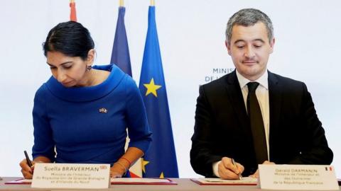 Home Secretary Suella Braverman and French Interior Minister Gérald Darmanin sign agreement