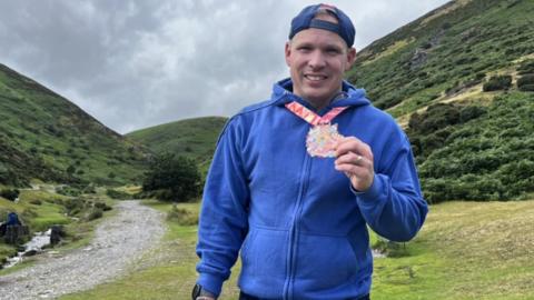 Nick Cockburn with badge