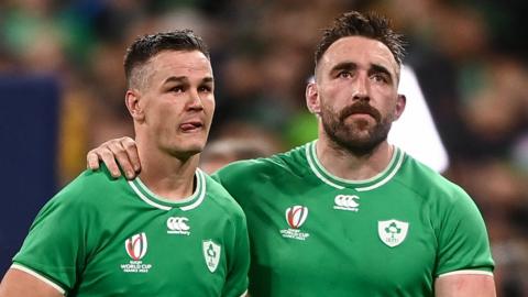 Johnny Sexton and Jack Conan show their disappointment after Ireland's loss to New Zealand