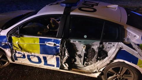 The damaged police car