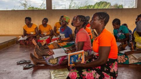 A group of woman attend a lesson at a school for wives and daughters of former Renamo members, May 2022