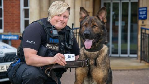 Police dog Olly and handler, PC Sam Clark