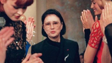 Hanae Mori being applauded by her models at the end of her autumn/winter collection show in Paris in 1998