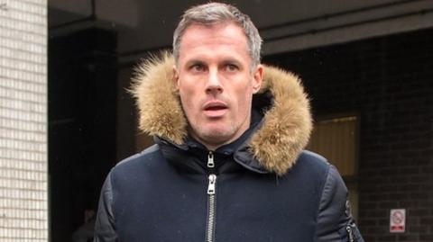 Jamie Carragher arrives at London Euston station on Monday