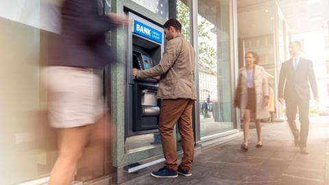 Man at cash machine