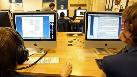 School children working on computers