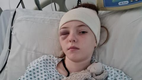 Grace in hospital following surgery to remove a brain tumour