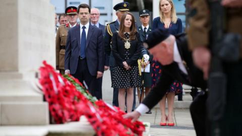 James Brokenshire and Nuala McAllister led the remembrance ceremony in the grounds of Belfast City Hall