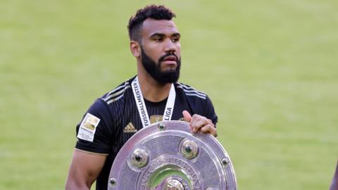 Cameroon and Bayern Munich striker Eric Maxim Choupo-Moting with the German Bundesliga trophy