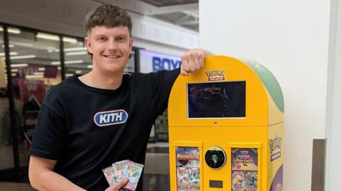 Alex Harrison with Pokémon vending machine