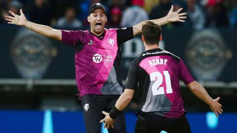 Lewis Gregory and Matt Henry celebrate