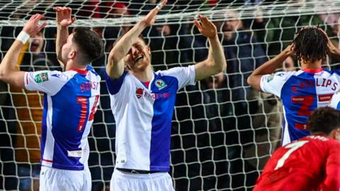 Blackburn players react with frustration to going 2-1 down against Forest