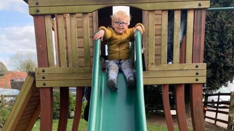 Larsen Roberts at the top of a slide