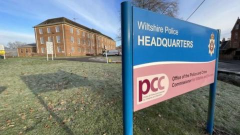 Wiltshire Police sign in front of the headquarters of the police force