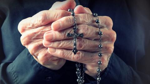 Woman with a rosary