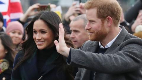 Prince Harry and Meghan Markle during a walkabout on the esplanade at Edinburgh Castle, during their visit to Scotland.