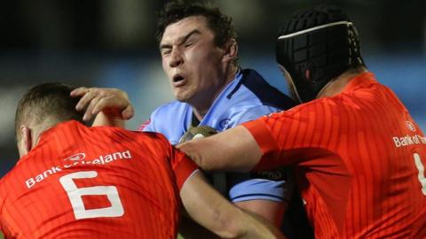 Seb Davies is halted by Munster's Jack O'Donoghue