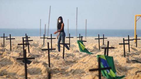 A Rio de Paz member helps create the "monument" on Copacabana