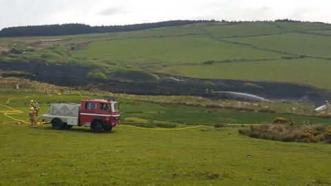 Firefighters tackle a blaze