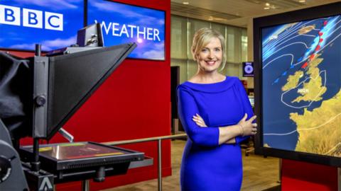 Weather presenter, Carol Kirkwood in a BBC News studio. 
