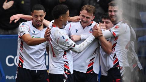 Sam Dalby celebrates with Bolton team-mates