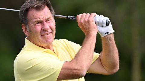 Sir Nick Faldo hitting a golf shot
