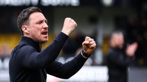Notts County boss Stuart Maynard thrusts his fists in the air as he celebrates a win