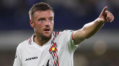 Jamie Vardy points as he plays for Cremonese on his debut against Verona