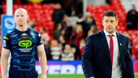 Wigan Warriors captain Liam Farrell and head coach Matt Peet walk from the field after their loss to Hull KR in the 2025 Super League Grand Final
