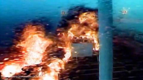 Image of an explosion after a cargo ship crashed into an oil tanker