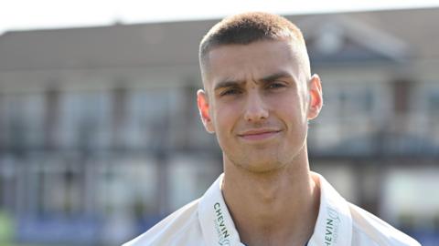 Harry Moore smiles for a Derbyshire squad profile picture