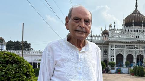 Faiyaz Ali Khan stands in front of the Bara Imambara in Lucknow 