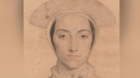 The image is a finely rendered pencil or chalk portrait of a person wearing a large, rounded hat and a high-collared garment—both typical of Renaissance or Tudor-era fashion. The artist’s technique emphasizes delicate shading and precise line work, especially around the eyes and facial contours, giving the subject a calm, dignified expression