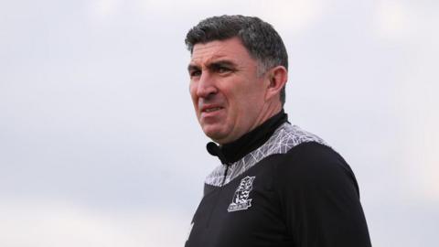 Southend boss Kevin Maher looks on during a match 